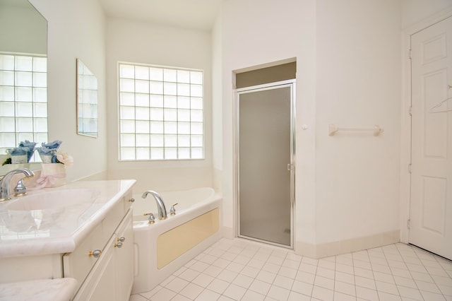 bathroom featuring tile patterned floors, vanity, and independent shower and bath