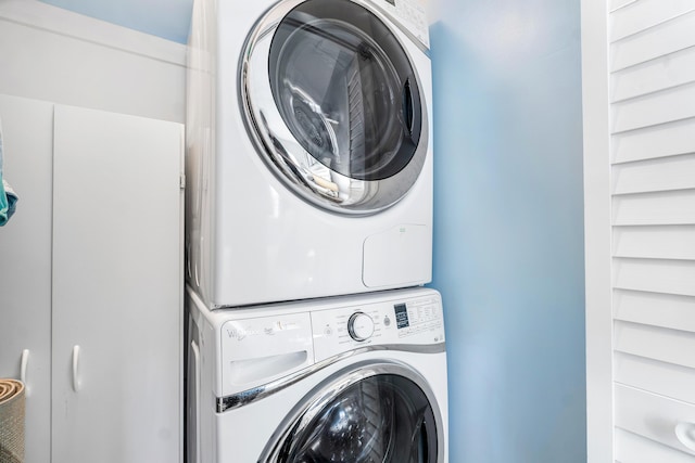 laundry room with stacked washer and dryer