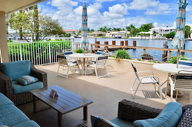 view of patio featuring a water view and an outdoor hangout area