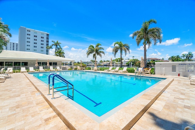 view of swimming pool featuring a patio area