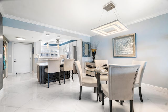 dining area featuring crown molding and ceiling fan