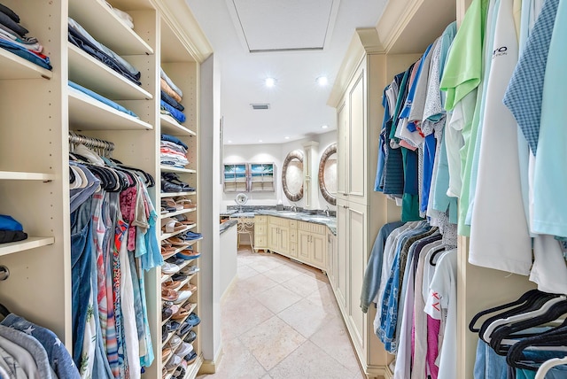 walk in closet featuring light tile patterned floors