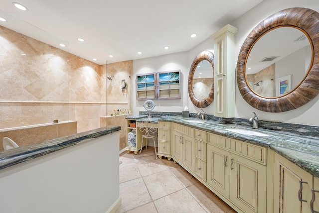 bathroom featuring tile patterned flooring and double vanity