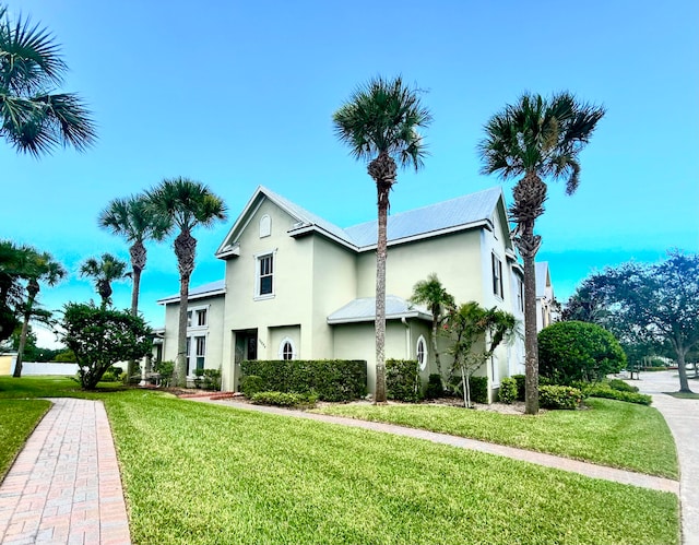 rear view of property with a yard