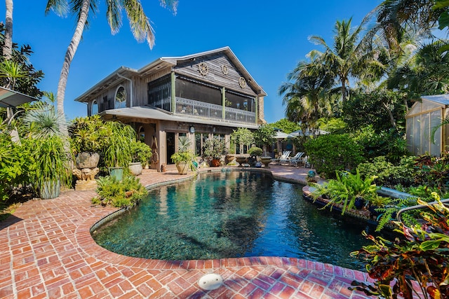 view of swimming pool featuring a patio