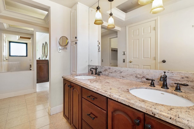 bathroom featuring vanity, ornamental molding, and tile patterned flooring