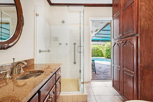 bathroom featuring ornamental molding, vanity, tile patterned floors, and an enclosed shower