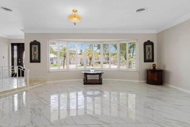 unfurnished living room featuring ornamental molding