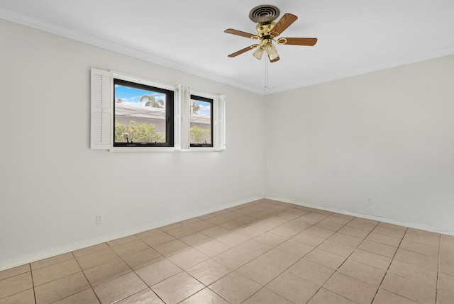 spare room featuring ornamental molding, ceiling fan, baseboards, and light tile patterned floors