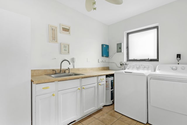 washroom with light tile patterned floors, laundry area, a sink, a ceiling fan, and washer and clothes dryer