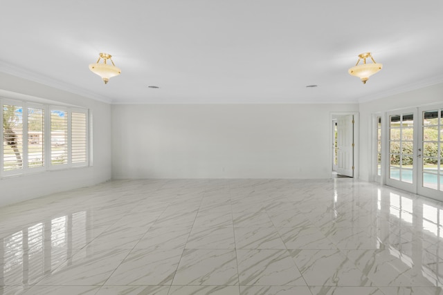 unfurnished room featuring ornamental molding, marble finish floor, and french doors