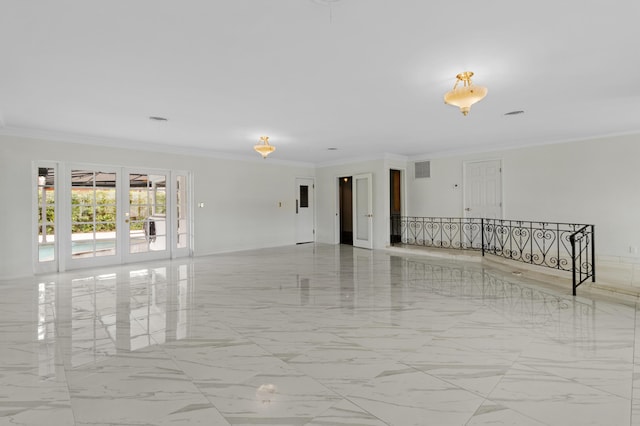 spare room featuring marble finish floor, visible vents, and crown molding