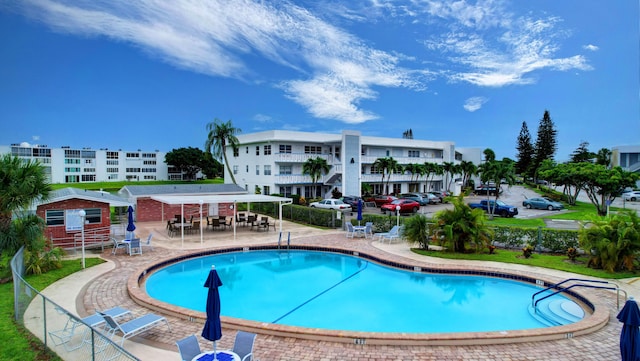 view of swimming pool with a patio