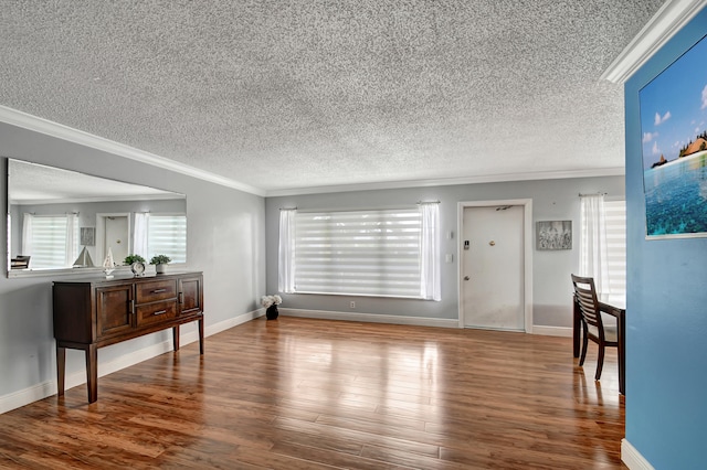 living room with crown molding, a textured ceiling, and wood-type flooring