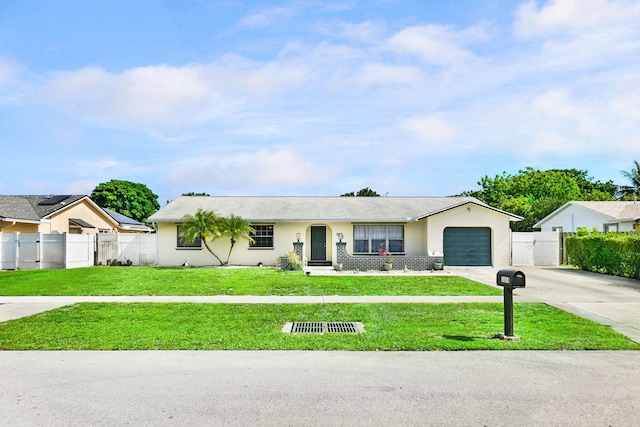 ranch-style home featuring a garage and a front yard