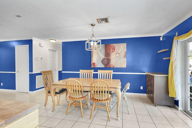 tiled dining space featuring ornamental molding and a notable chandelier