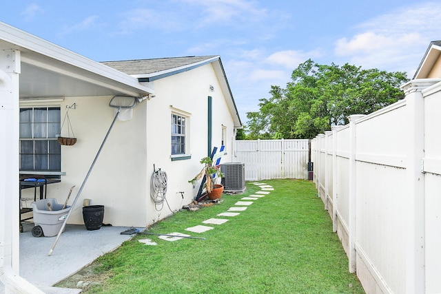 view of yard featuring central AC