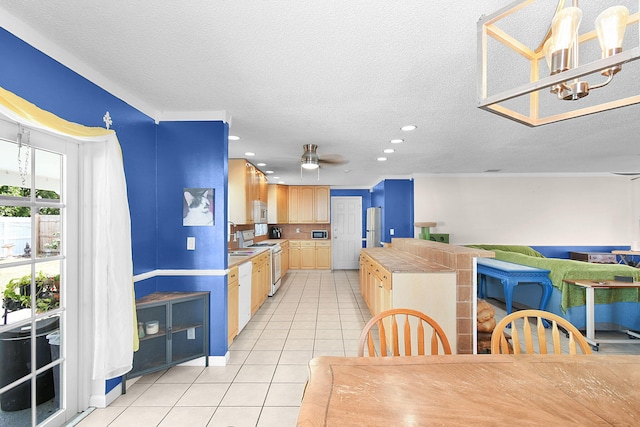 kitchen with ceiling fan, light brown cabinets, a textured ceiling, white appliances, and light tile patterned floors