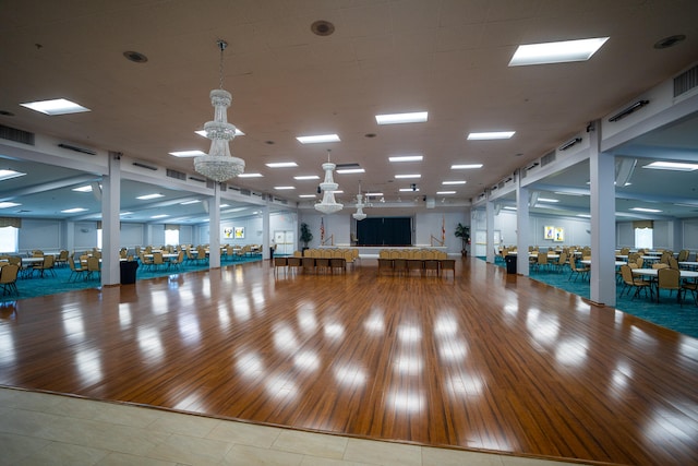 interior space featuring wood-type flooring and a pool