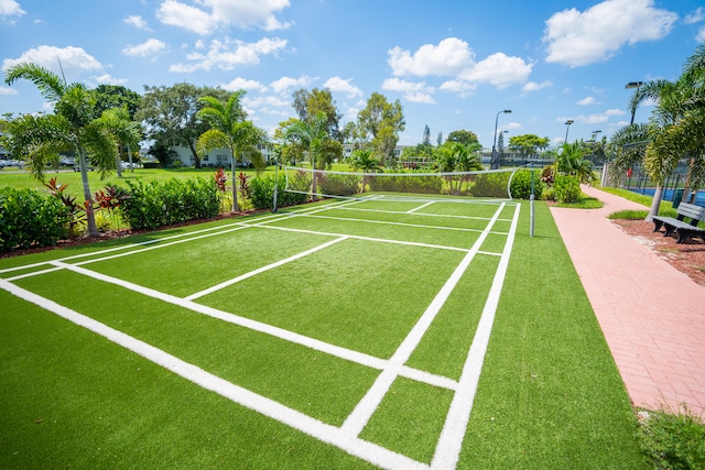 view of property's community with tennis court