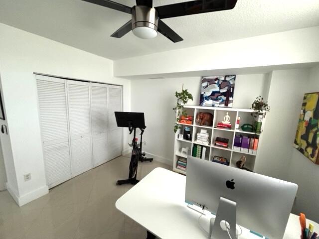 office space featuring ceiling fan