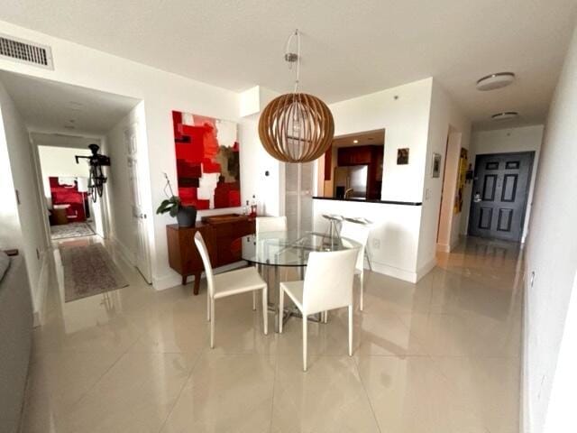 dining room with light tile patterned floors