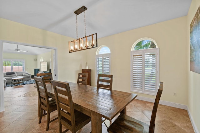 dining space with light tile patterned floors and baseboards