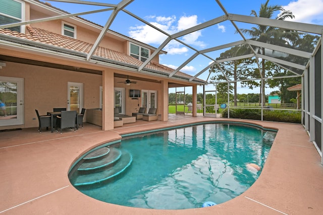 pool with an outdoor hangout area, a patio, and ceiling fan