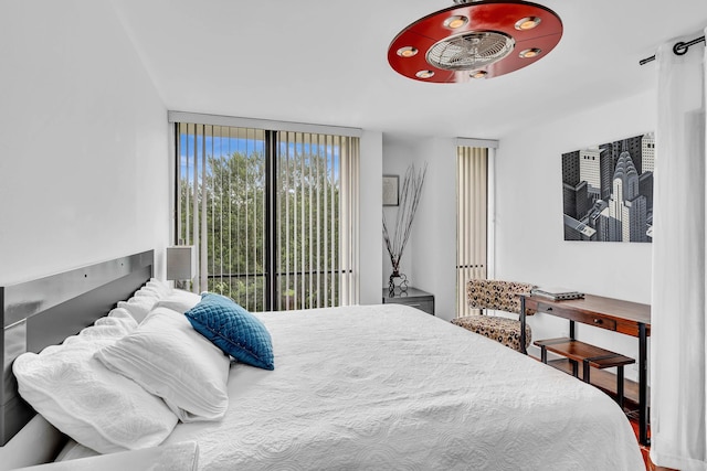 bedroom with floor to ceiling windows