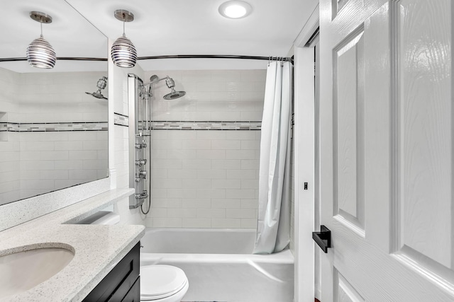 full bathroom with toilet, vanity, and shower / bath combo with shower curtain