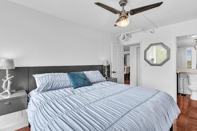 bedroom with ceiling fan and ensuite bathroom