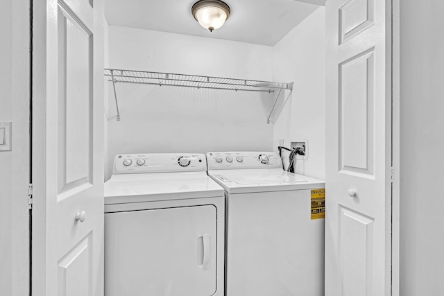 washroom featuring washer and dryer