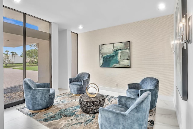 sitting room featuring expansive windows