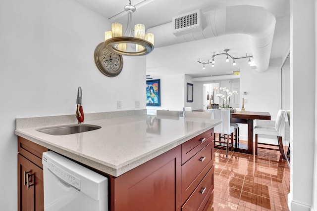 kitchen featuring a notable chandelier, sink, white dishwasher, light stone countertops, and light tile patterned floors