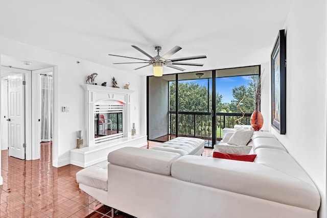 living room with ceiling fan, parquet flooring, and floor to ceiling windows