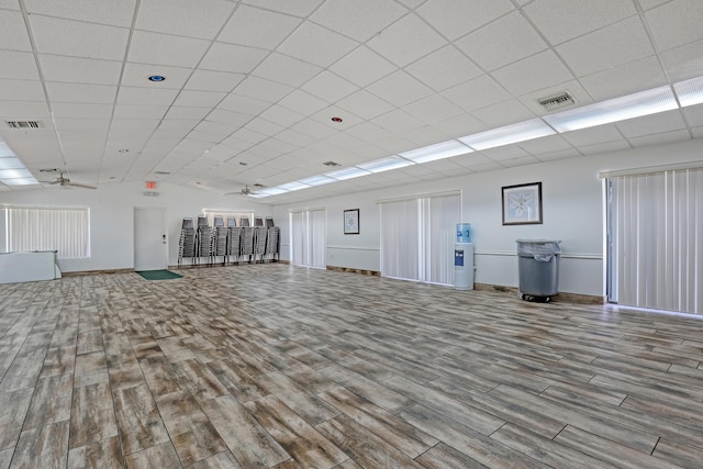 interior space with ceiling fan