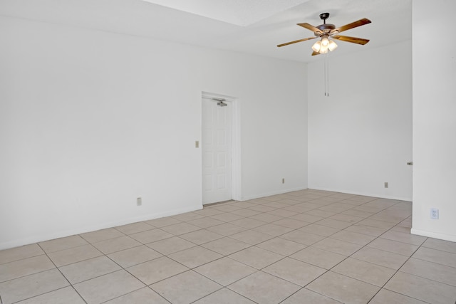 unfurnished room featuring ceiling fan and light tile patterned floors