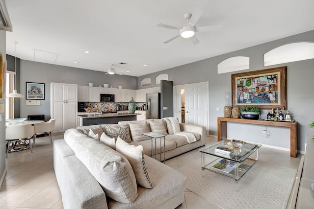 tiled living room featuring ceiling fan