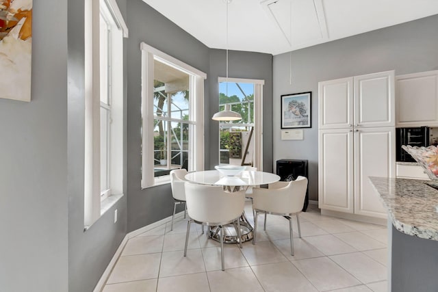 dining area featuring light tile patterned flooring