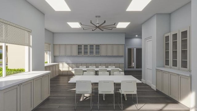 dining room with dark hardwood / wood-style floors and an inviting chandelier