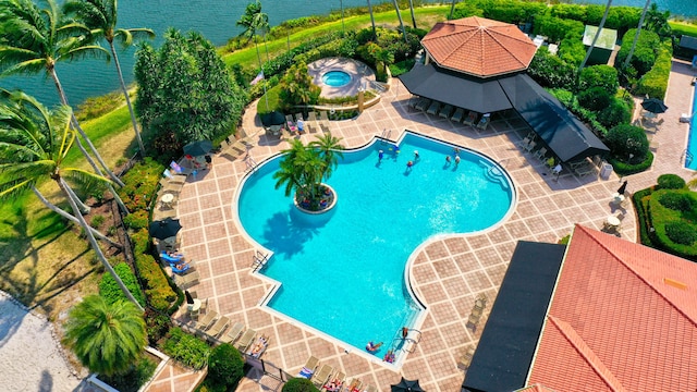 view of pool featuring a water view