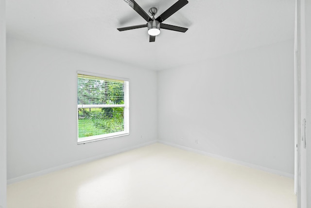 spare room featuring ceiling fan and light colored carpet