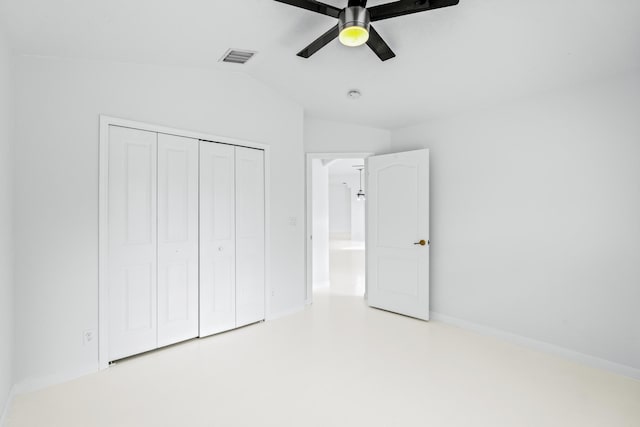 unfurnished bedroom featuring ceiling fan, a closet, and lofted ceiling