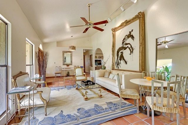 sitting room with tile patterned flooring, ceiling fan, and lofted ceiling