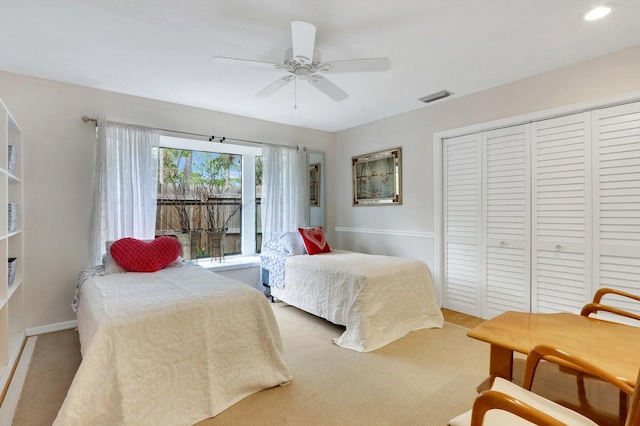 carpeted bedroom with ceiling fan