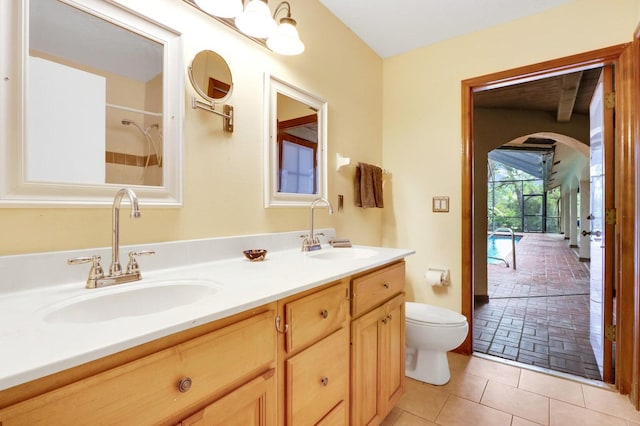 bathroom with tile patterned floors, vanity, and toilet