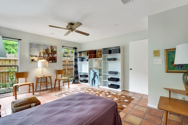 bedroom featuring ceiling fan and light tile patterned floors