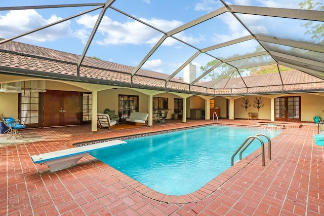 view of swimming pool with french doors, an outdoor hangout area, a lanai, a diving board, and a patio