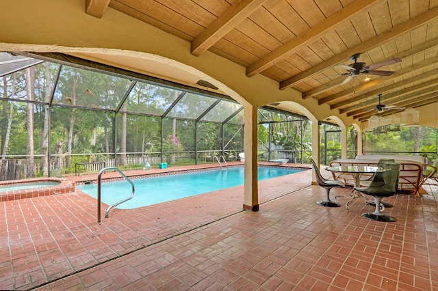 view of pool featuring ceiling fan, a lanai, an in ground hot tub, and a patio