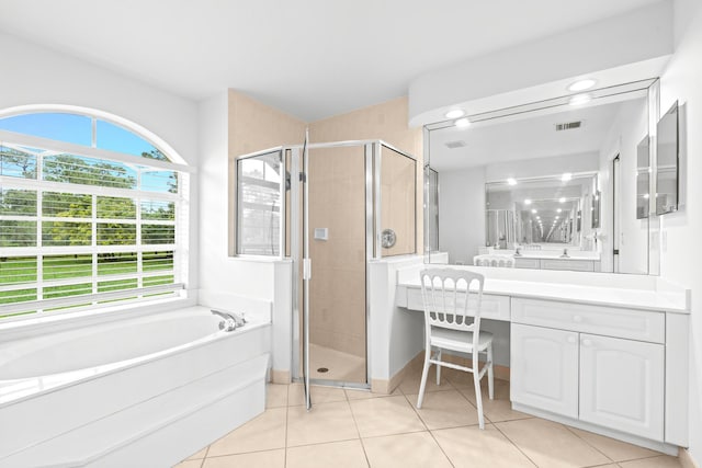 bathroom featuring tile patterned flooring, vanity, and independent shower and bath